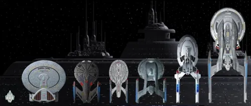 Ein Bild der Trinity Flotte. Die Schiffe von oben betrachtet der Größe nach nebeneinander vor einem Ausschnitt der Trinity.